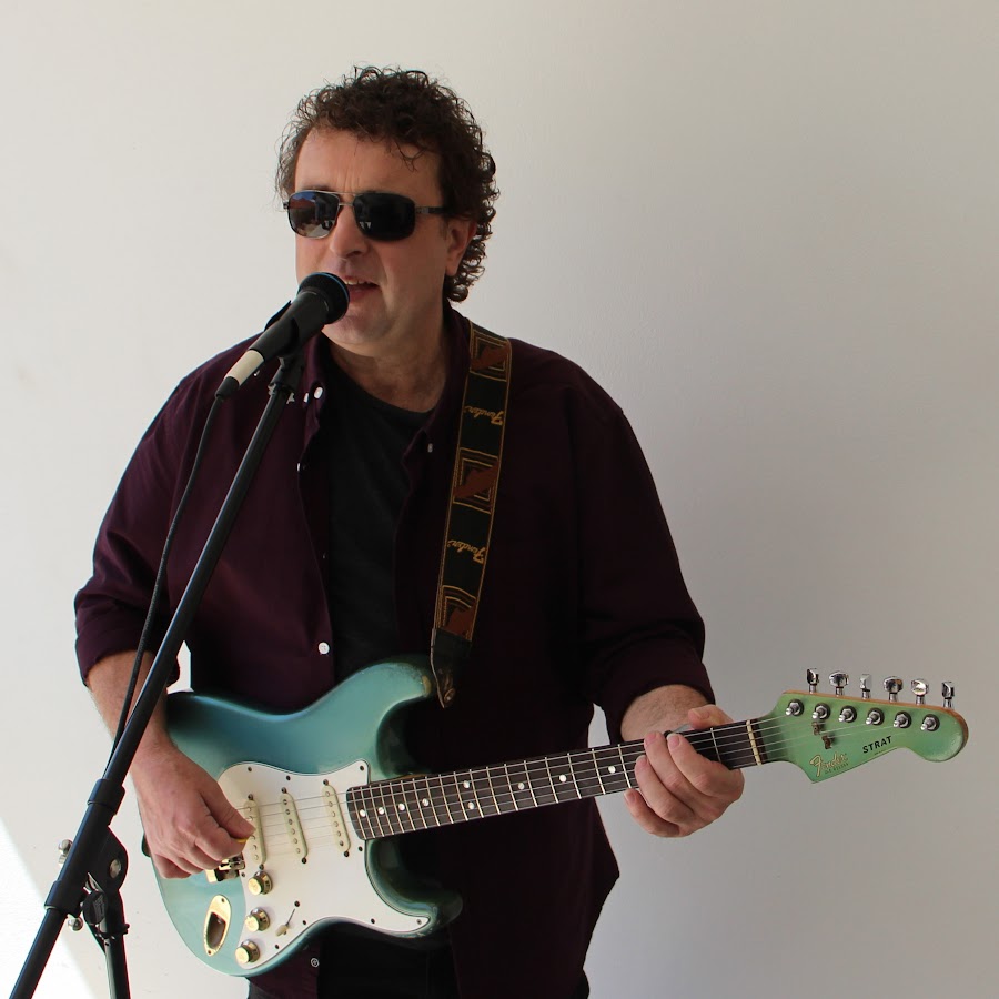 Vic Stathopoulos with Blue Fender Strat Guitar